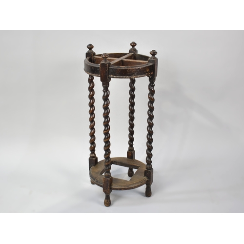 140 - An Edwardian Oak Circular Four Section Stick Stand with Barley Twist Supports, Missing Metal Drip Tr... 