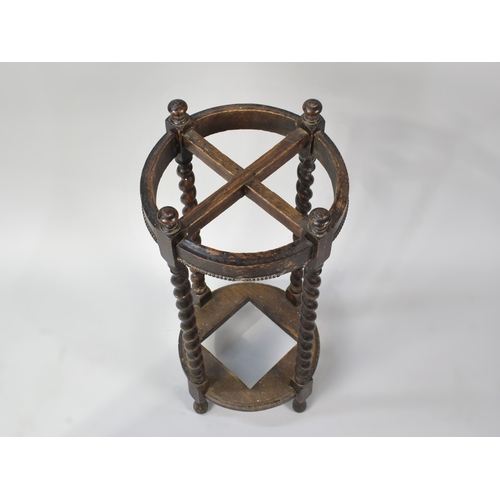 140 - An Edwardian Oak Circular Four Section Stick Stand with Barley Twist Supports, Missing Metal Drip Tr... 