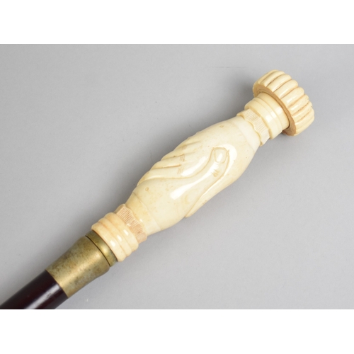 142 - A Modern Ebonised Walking Cane with Reproduction Carved Bone Handle in the Form of Two Clasped Hands