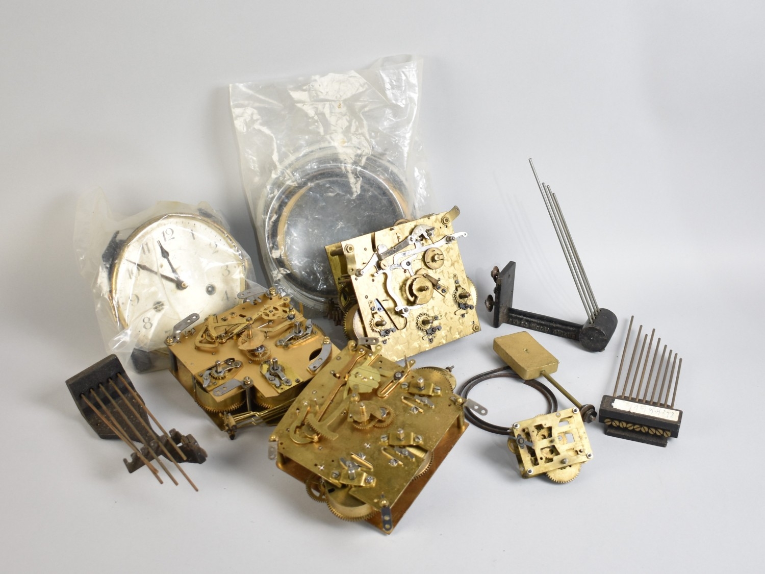 A Collection of Various Clock Movements and Spare Parts
