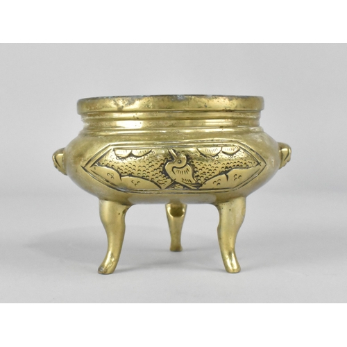 64 - A Chinese Polished Bronze Three Legged Censer, 10cms Diameter and 7.5cms High
