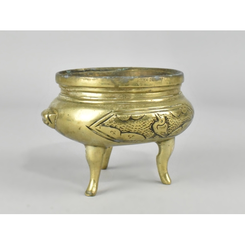 64 - A Chinese Polished Bronze Three Legged Censer, 10cms Diameter and 7.5cms High