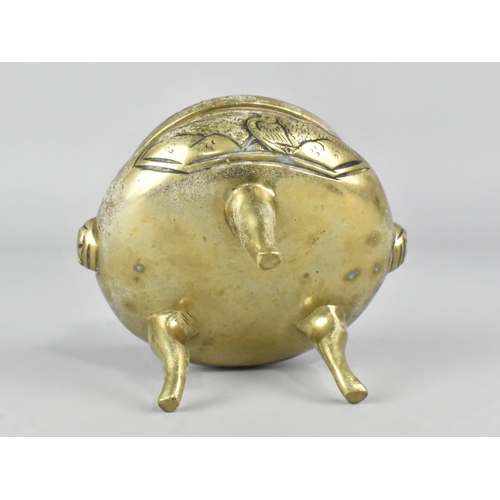 64 - A Chinese Polished Bronze Three Legged Censer, 10cms Diameter and 7.5cms High
