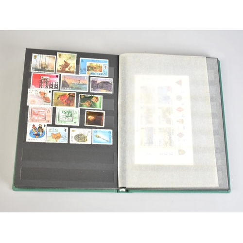 212 - A Stamp Stock Book Containing Channel Island Stamps for Jersey, Guernsey and Alderney