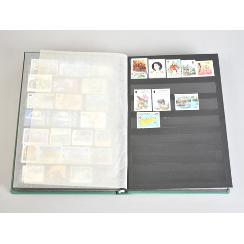 212 - A Stamp Stock Book Containing Channel Island Stamps for Jersey, Guernsey and Alderney