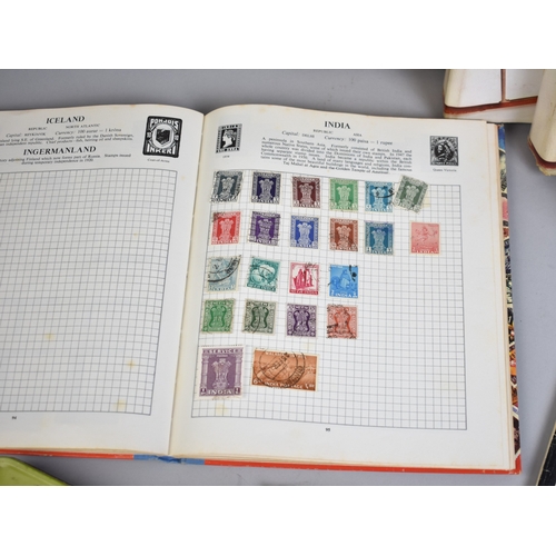 213 - A Collection of Eight Stamp Albums and Contents, Loose Stamps, Books on Stamps, PHQ Cards Etc