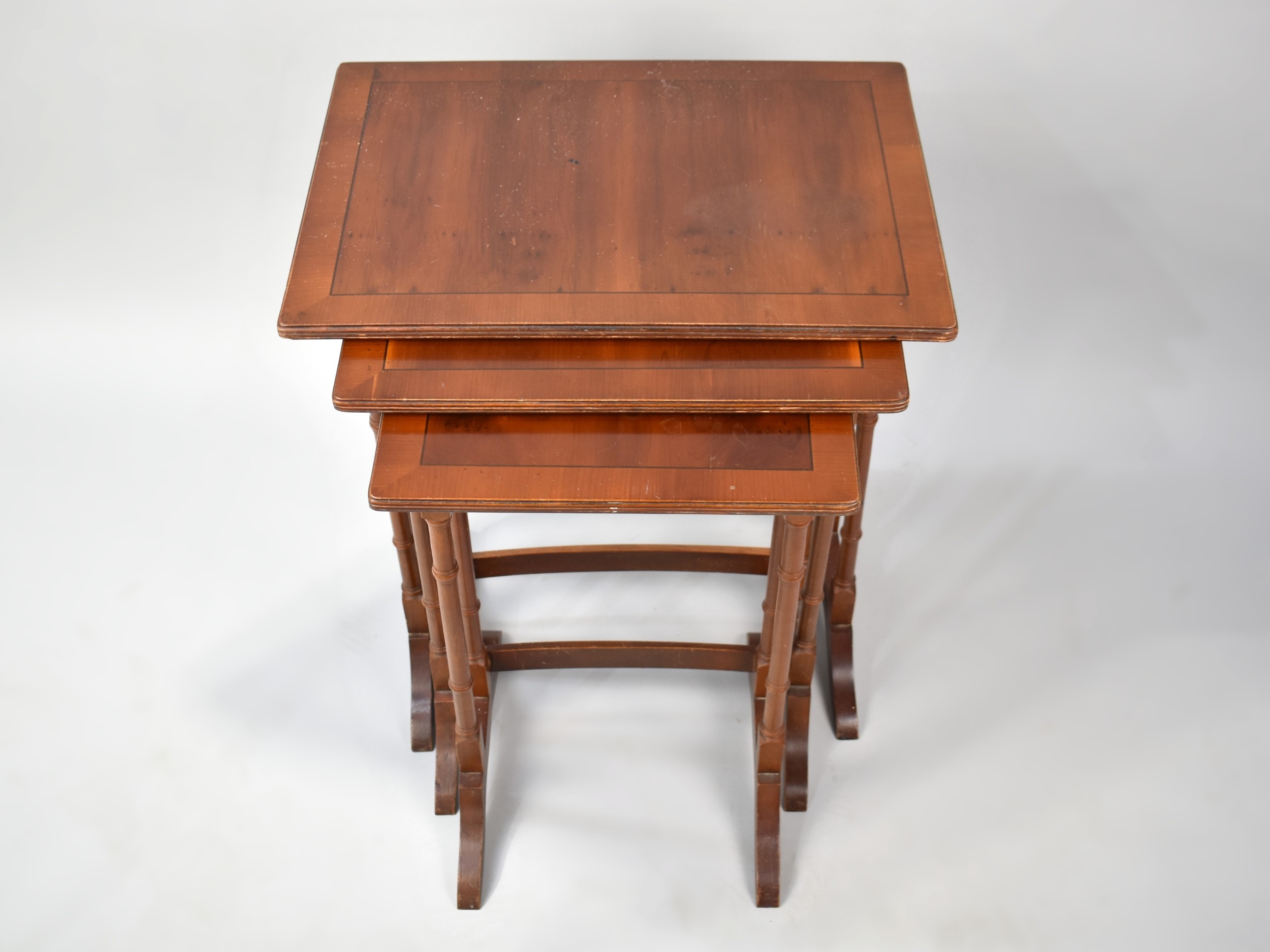 A Cross Banded Nest of Three Mahogany Tables, 49cms Wide