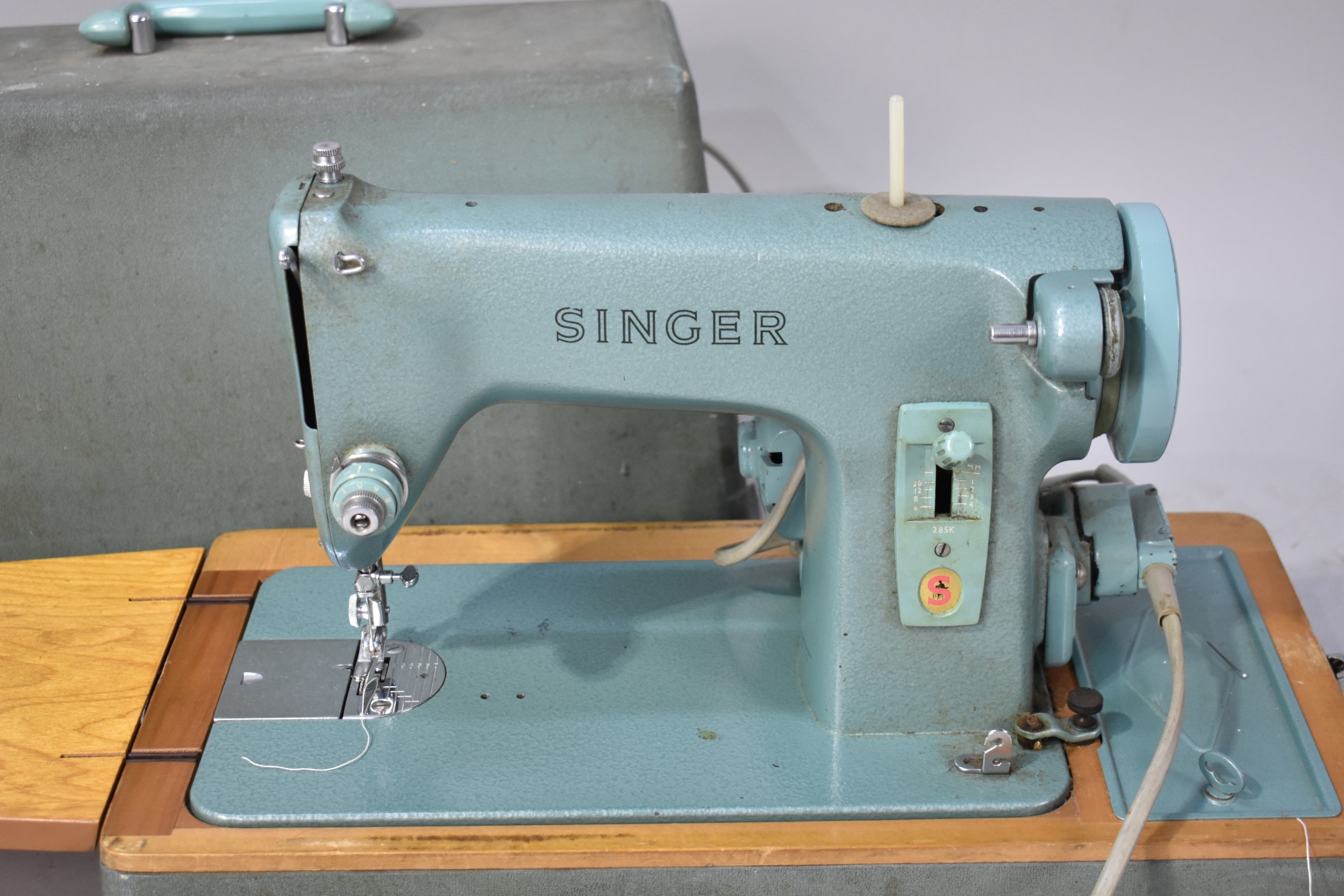 A Vintage Singer Electric Sewing Machine with Power Cable and Foot Control