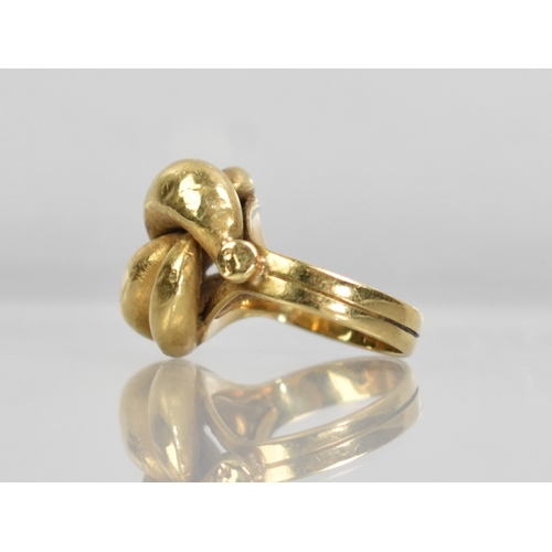 1 - An Eastern 18ct Gold Knot Ring, 6.9gms, Stamped 750 to the Interior, Size J.5