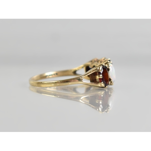 9 - A 9ct Gold, Opal and Garnet Mounted Five Stone Ring, Cabochon Opals and Oval Cut Garnets Mounted in ... 