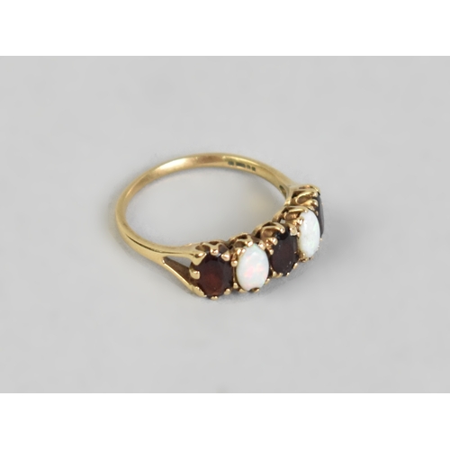 9 - A 9ct Gold, Opal and Garnet Mounted Five Stone Ring, Cabochon Opals and Oval Cut Garnets Mounted in ... 