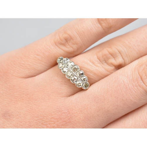 25 - An Edwardian Diamond, 18ct Gold and Platinum Ring, Twelve Matched and Paired Graduated Round Mine Cu... 