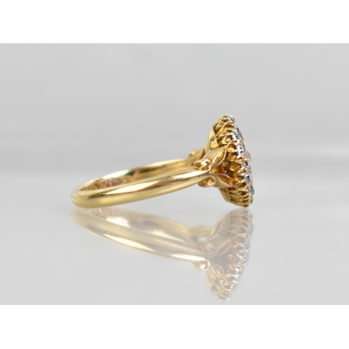 26 - An Edwardian Ruby, Diamond and 18ct Gold Three Layer Cluster Ring Comprising Central Round Cut Grain... 
