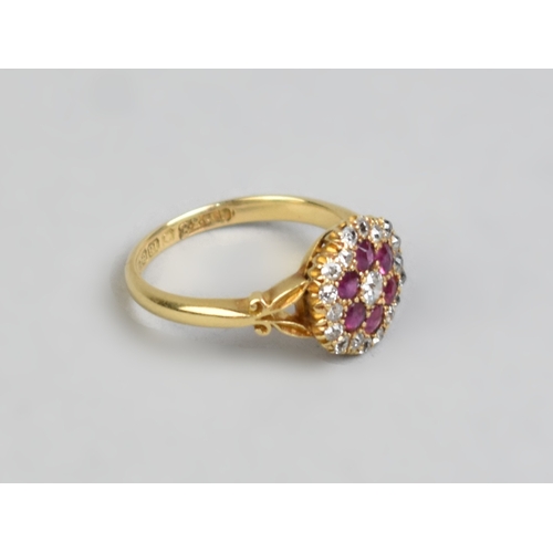 26 - An Edwardian Ruby, Diamond and 18ct Gold Three Layer Cluster Ring Comprising Central Round Cut Grain... 