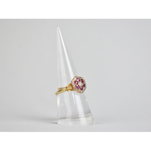 26 - An Edwardian Ruby, Diamond and 18ct Gold Three Layer Cluster Ring Comprising Central Round Cut Grain... 