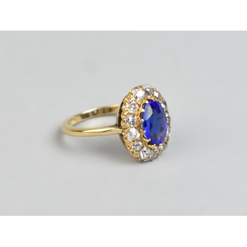 30 - An Impressive Vivid Blue Garnet Topped Doublet and Diamond Ring, Central Mixed Oval Cut Stone Measur... 