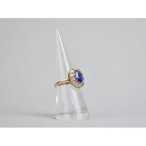 30 - An Impressive Vivid Blue Garnet Topped Doublet and Diamond Ring, Central Mixed Oval Cut Stone Measur... 