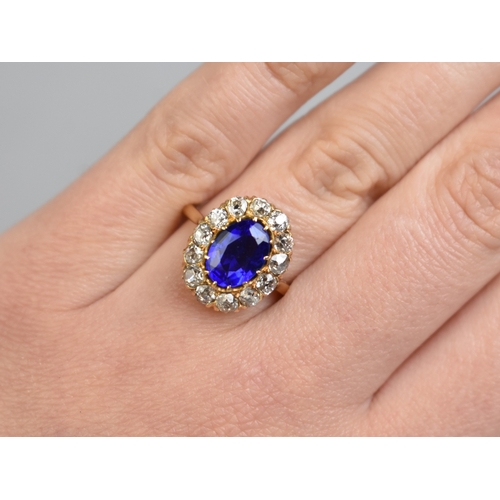 30 - An Impressive Vivid Blue Garnet Topped Doublet and Diamond Ring, Central Mixed Oval Cut Stone Measur... 