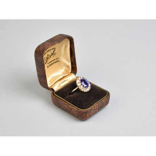30 - An Impressive Vivid Blue Garnet Topped Doublet and Diamond Ring, Central Mixed Oval Cut Stone Measur... 