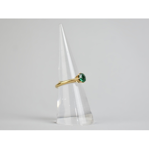 32 - A Green Paste Garnet Topped Doublet, Round Mixed Cut Stone Measuring 5.9mm Diameter Set in Four Claw... 