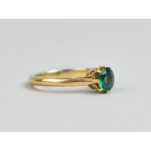 32 - A Green Paste Garnet Topped Doublet, Round Mixed Cut Stone Measuring 5.9mm Diameter Set in Four Claw... 