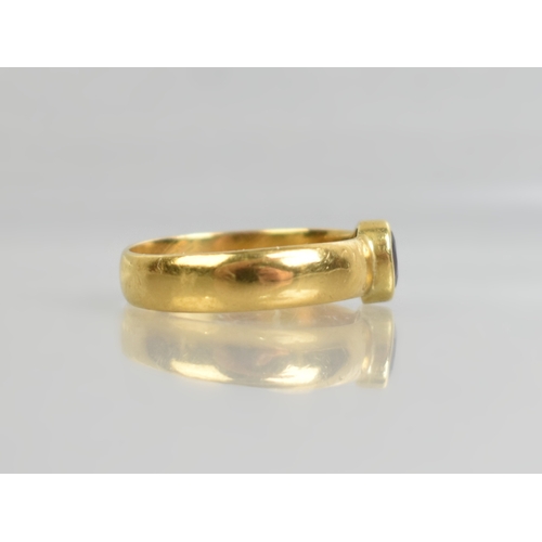 34 - A Gold Metal Ring with Central Mixed Oval Cut Almandine-Pyrope Garnet, Bezel Set and Measuring 5.4mm... 