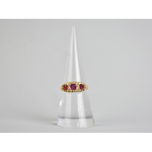 35 - A Ruby and Diamond Boat Shape Ring (One Coloured Side Stone is Replacement Paste), Central Mixed Cus... 