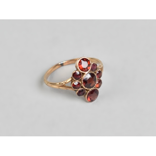 12 - An Antique Almandine-Pyrope Garnet Cluster Ring in Unmarked Gold Coloured Metal, Three Mixed Round C... 