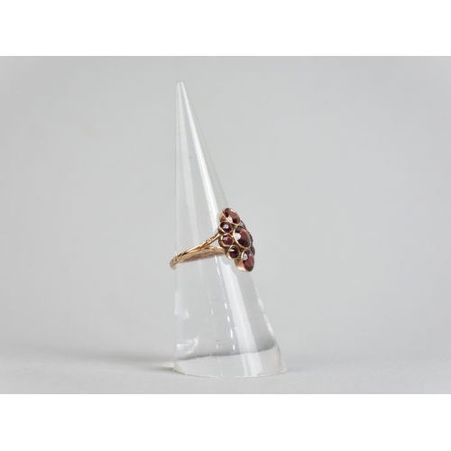12 - An Antique Almandine-Pyrope Garnet Cluster Ring in Unmarked Gold Coloured Metal, Three Mixed Round C... 