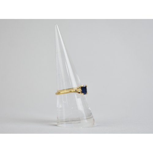 48 - A Sapphire Doublet Ladies Dress Ring, Emerald Cut Stone Measuring 4mm by 6mm Raised in Four Claws to... 