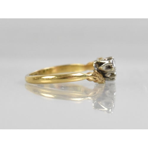 52 - An 18ct Gold and Platinum Mounted Diamond Trilogy Ring, Primary Round Cut Stone Set in Ten Claws and... 