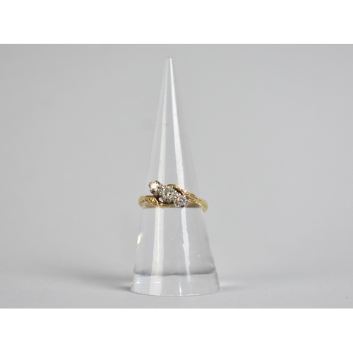 52 - An 18ct Gold and Platinum Mounted Diamond Trilogy Ring, Primary Round Cut Stone Set in Ten Claws and... 