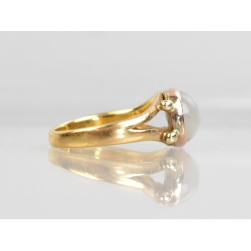 54 - An Antique White Stone Cabochon Ring Mounted in Gold Metal on a 22ct Gold Band, Bezel Set Circular C... 