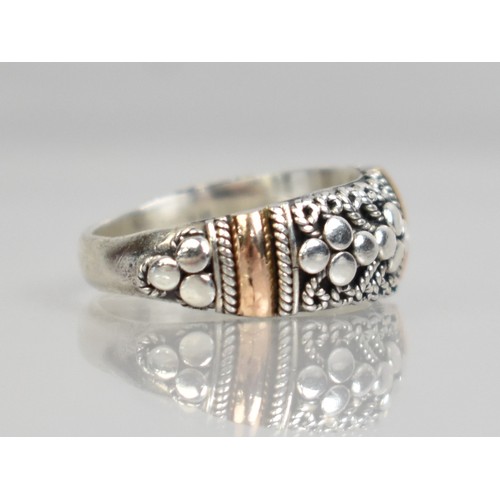 41 - An 18ct Gold Mounted Silver Ring by Suarti with Cannatille and Polished Decoration, Size K.5, 5.6gms
