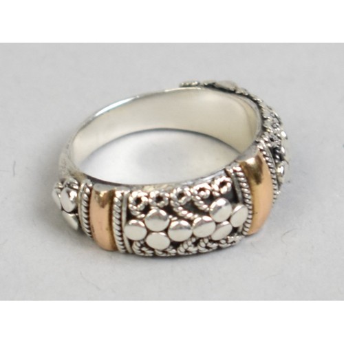 41 - An 18ct Gold Mounted Silver Ring by Suarti with Cannatille and Polished Decoration, Size K.5, 5.6gms