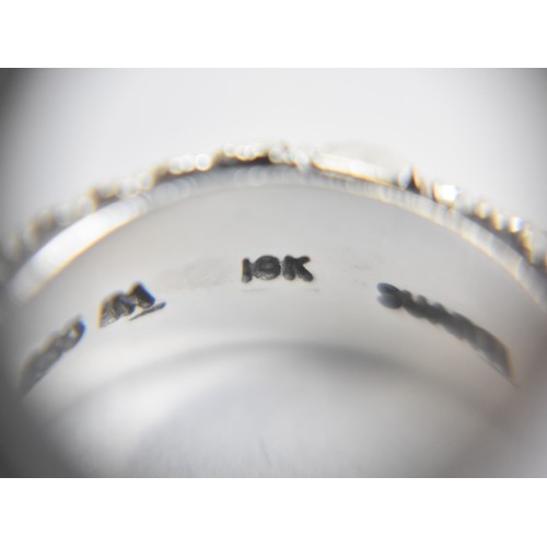 41 - An 18ct Gold Mounted Silver Ring by Suarti with Cannatille and Polished Decoration, Size K.5, 5.6gms