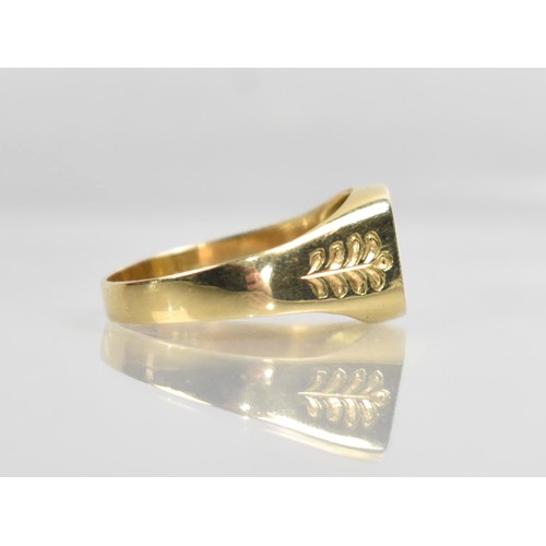23A - A 14ct Gold and Ruby Signet Ring, Rectangular Head with Round Cut Grain Set Ruby, Engraved Shoulders... 