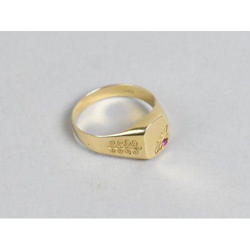 23A - A 14ct Gold and Ruby Signet Ring, Rectangular Head with Round Cut Grain Set Ruby, Engraved Shoulders... 