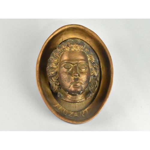 53 - A Carved Giltwood Portrait Bust of Mozart in Oval Frame, 20cms High