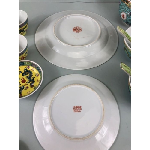 101 - Oriental ceramics, a collection modern of Chinese ceramics  in Famille designs to include Plates Bow... 