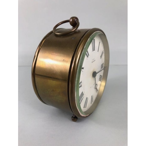 105 - Antique clock, Brass cased drum mantel clock printed dial with Roman numerals marked EXD By MANN Bev... 