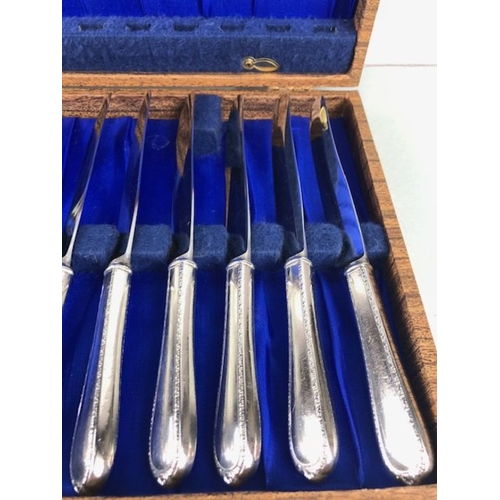 107 - Silver Cutlery, boxed set of dinner knives and forks from the American international company all mar... 