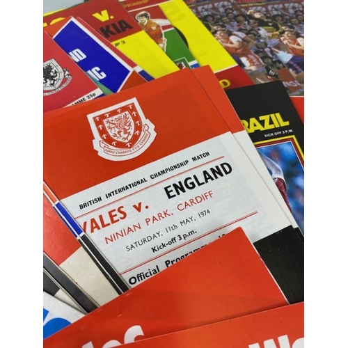 112 - Football interest, collection of Wales international football programs from the 70s 80s to include  ... 