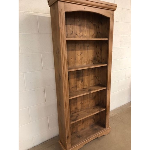 127 - Pine furniture , Tall Narrow pine bookcase with reeded decoration to front approximately 76 x 21 x 8... 