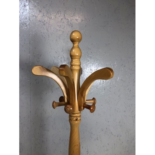 131 - Coat stand, modern light wood coat and hat stand on tripod base approximately 79 cm high