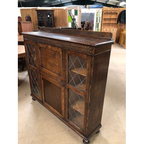 147 - Furniture, 20th century oak bureaux display cabinet on bun feet, leaded glass display sections with ... 