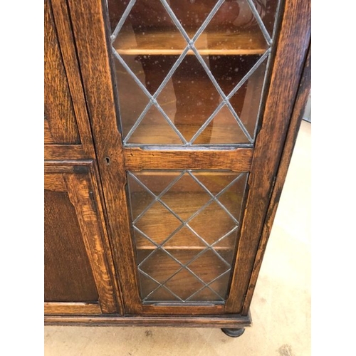 147 - Furniture, 20th century oak bureaux display cabinet on bun feet, leaded glass display sections with ... 