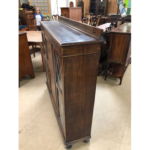 147 - Furniture, 20th century oak bureaux display cabinet on bun feet, leaded glass display sections with ... 