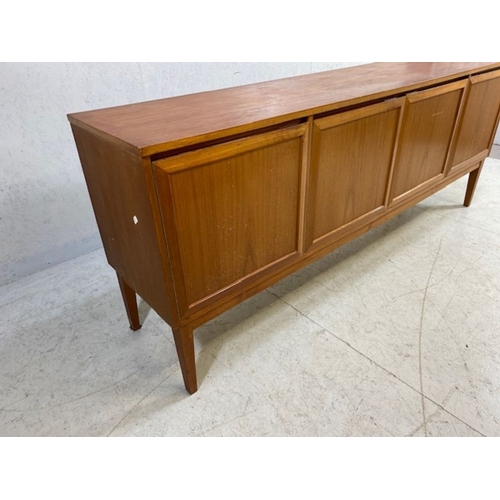 152 - Mid century furniture, 1970s long sideboard, on slayed legs  comprising of a 2 door central cupboard... 