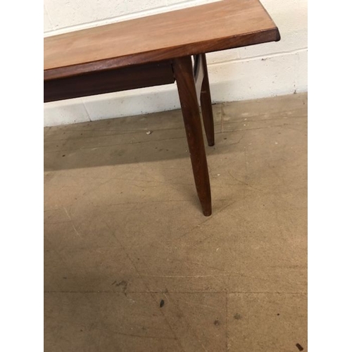 155 - Mid century furniture, 1970s long coffee table on round tapered legs approximately 120 x 40 x 41cm